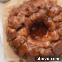 An overhead view of monkey bread on a piece of brown parchment paper.