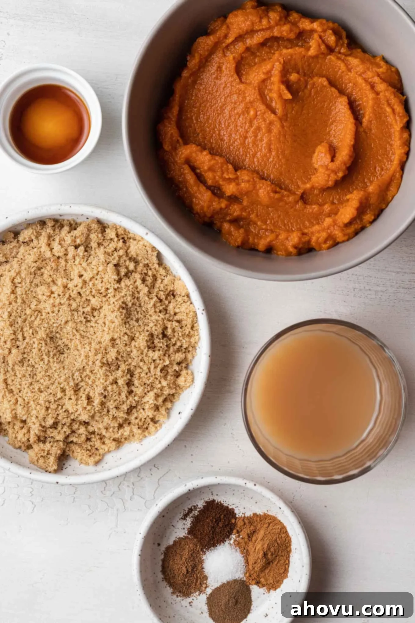 Autumn's Golden Spread 3 An inviting overhead view showcasing all the fresh, high-quality ingredients neatly arranged for making homemade pumpkin butter, including pumpkin puree, apple cider, brown sugar, and a selection of whole and ground spices.