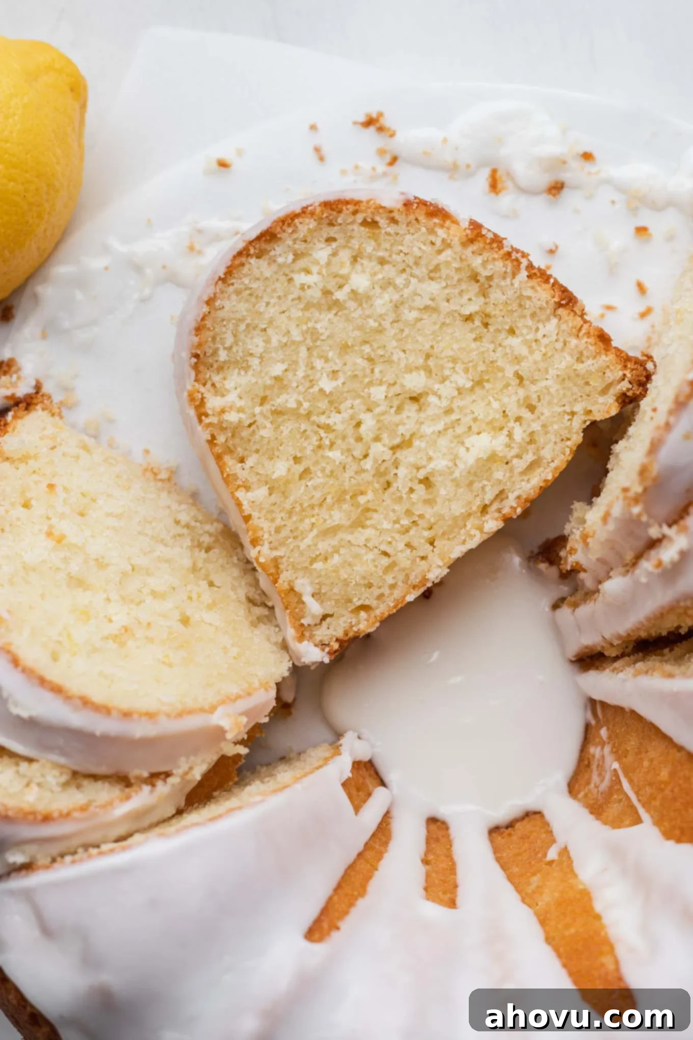 A close up, overhead view of a sliced lemon sour cream pound cake. 