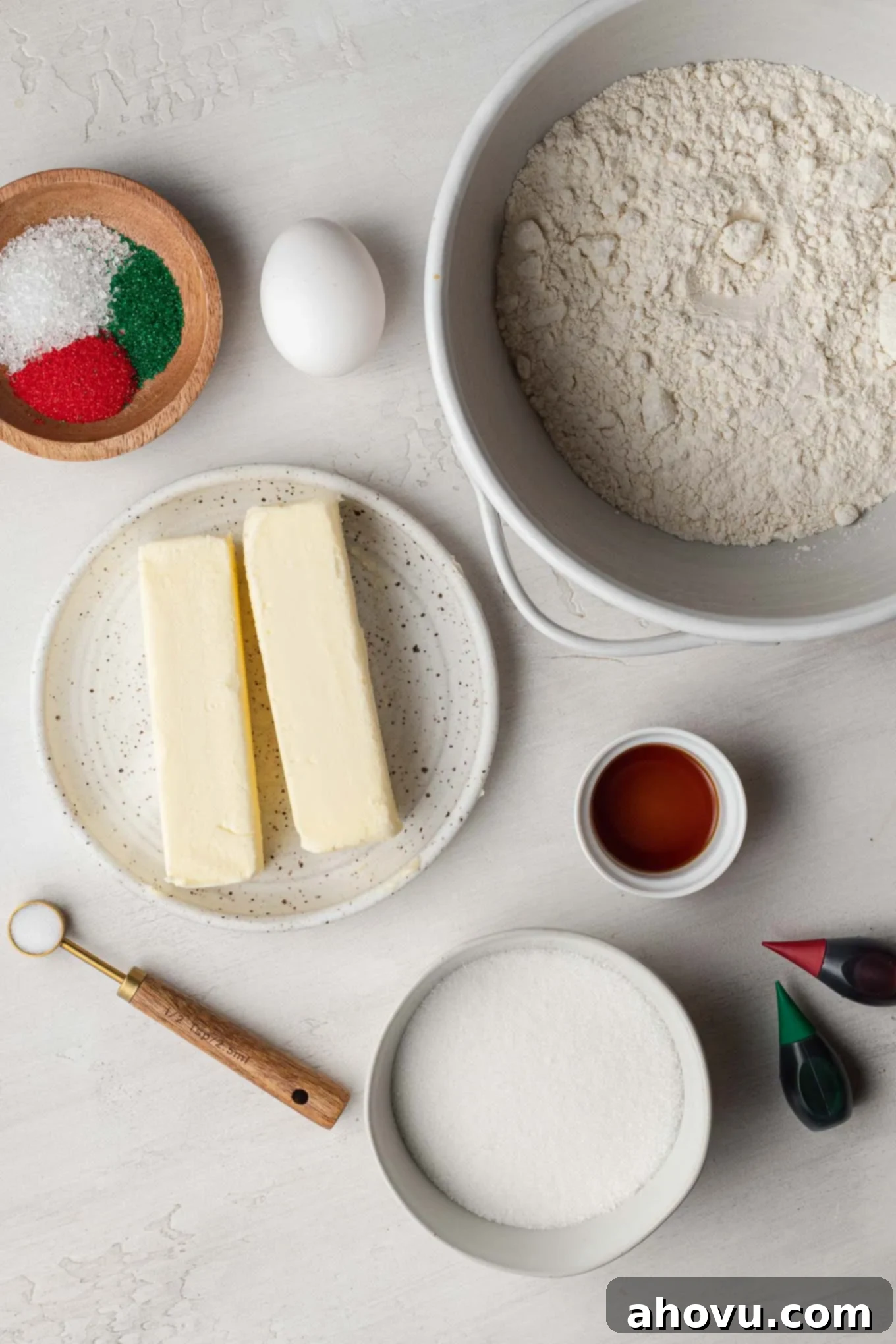 An overhead view of the ingredients needs to make spritz butter cookies. 