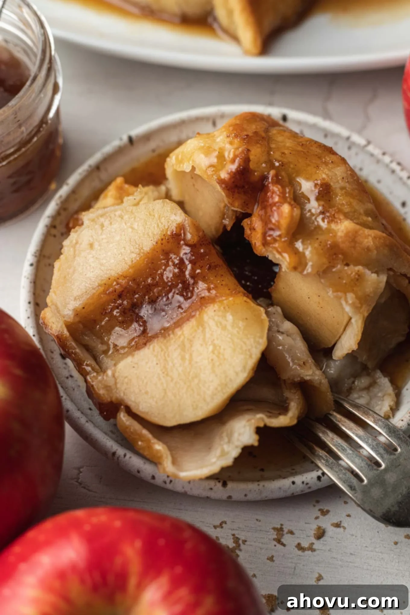 A dumping cut in half to show the apple inside. 