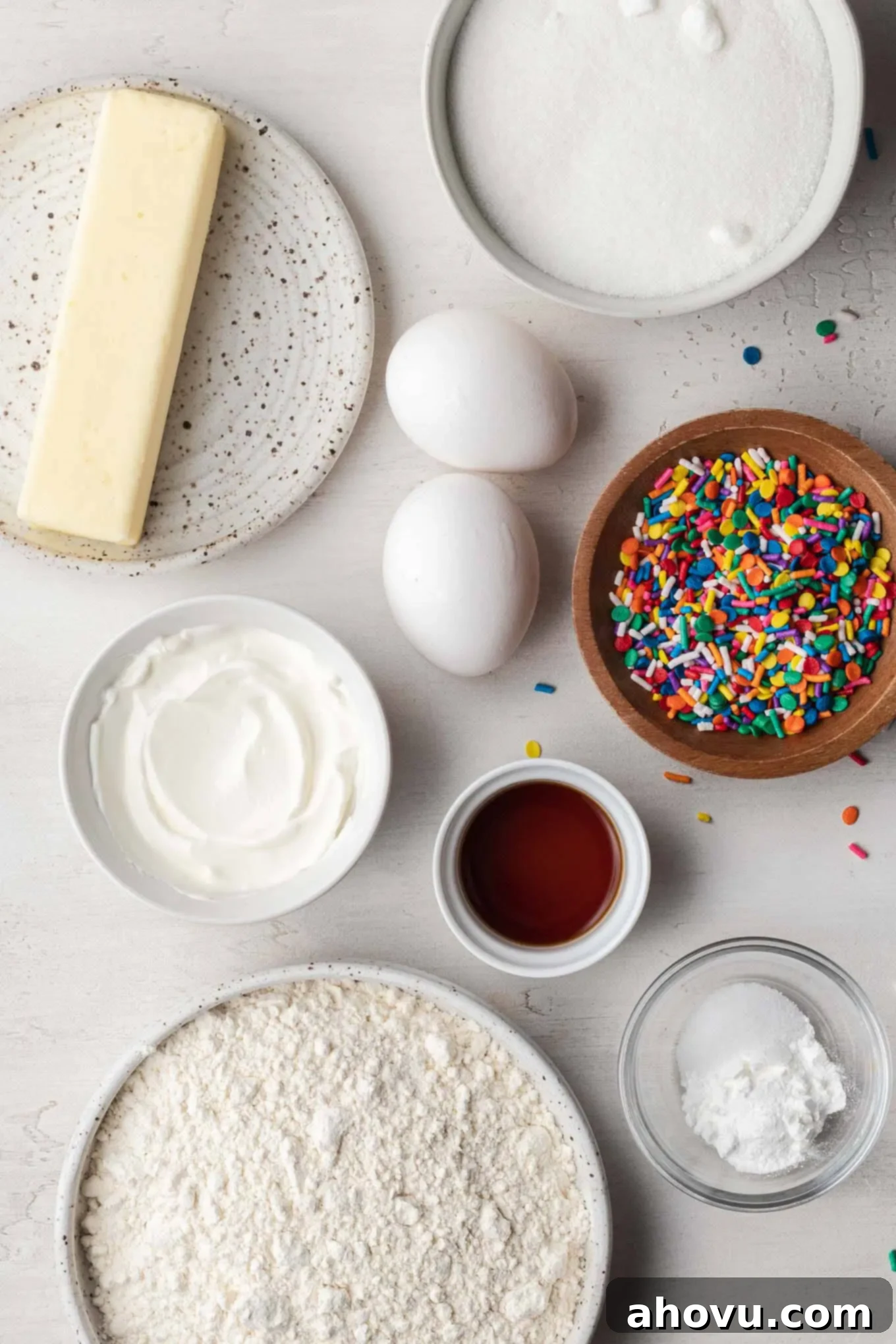 Overhead view of the ingredients needed to make vanilla cupcakes from scratch.