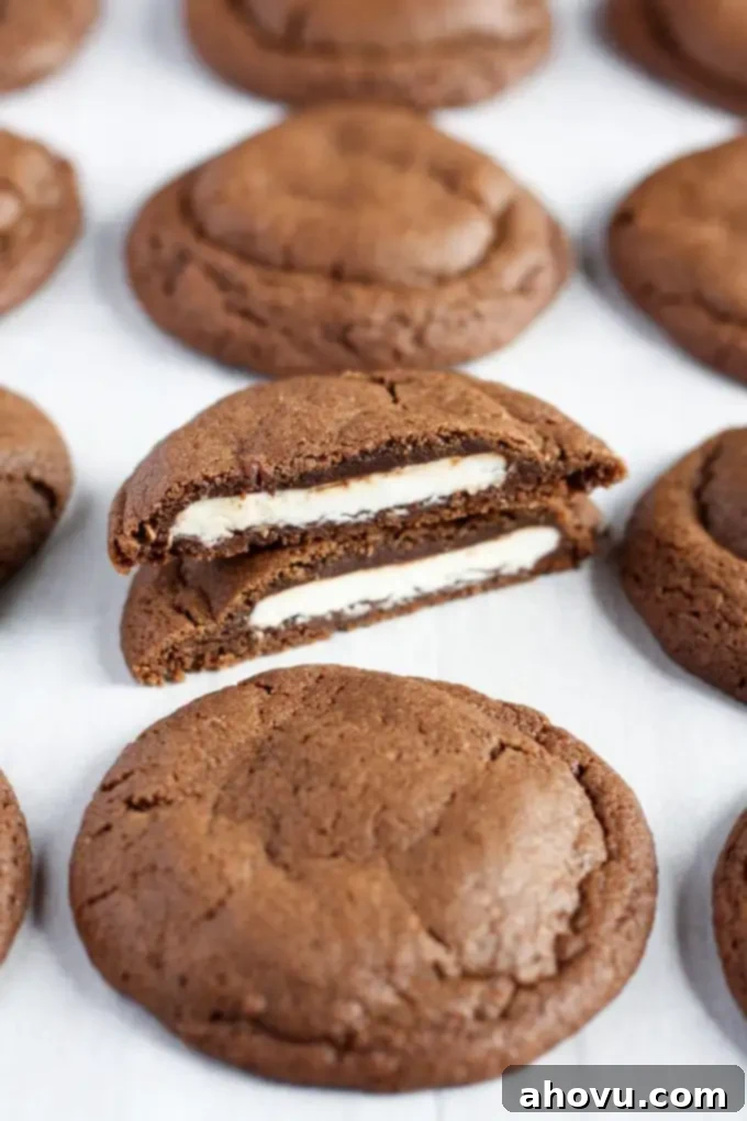 Close-up of a freshly baked peppermint patty stuffed chocolate cookie, showing its rich texture.