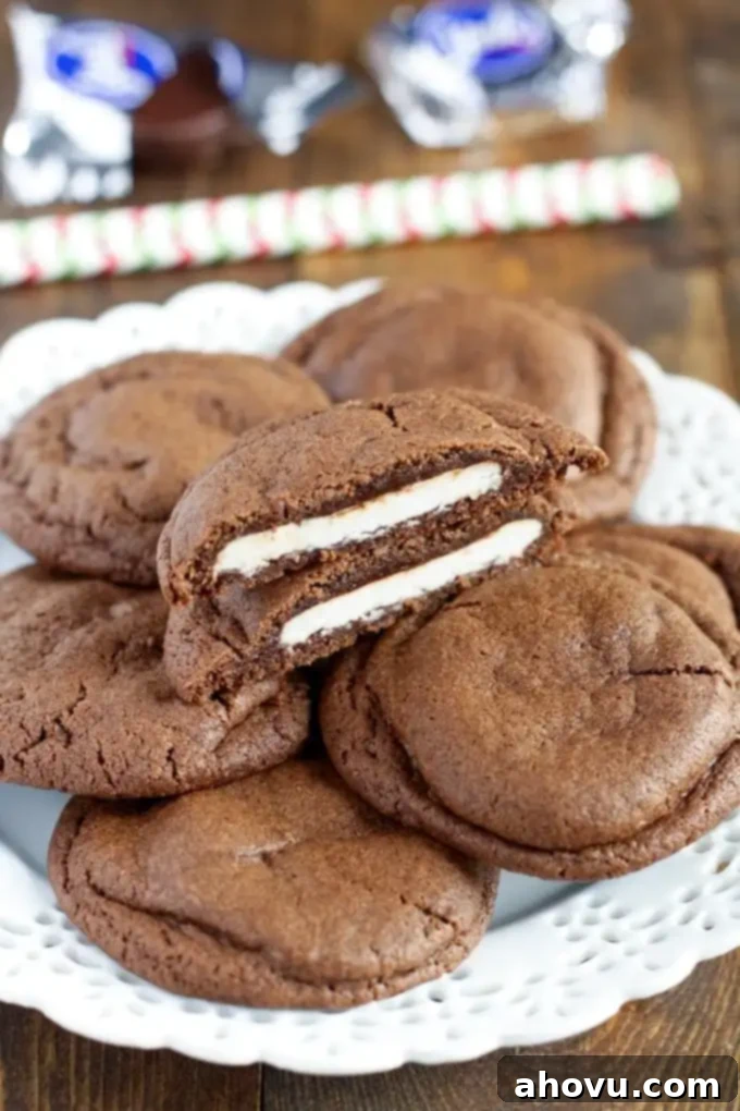 A plate of warm chocolate cookies with peppermint patty filling, ready to be enjoyed.