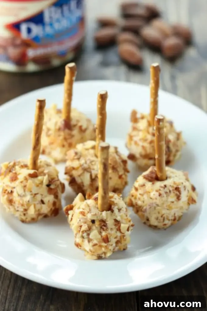 Irresistible Smoked Almond Cheese Poppers 3 Easy to make mini cheese balls coated in Blue Diamond Smokehouse Almonds. These make a great football or holiday party appetizer!