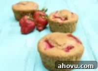Rustic Whole Wheat Strawberry Muffins 4 Whole Wheat Strawberry Muffins on a cooling rack.