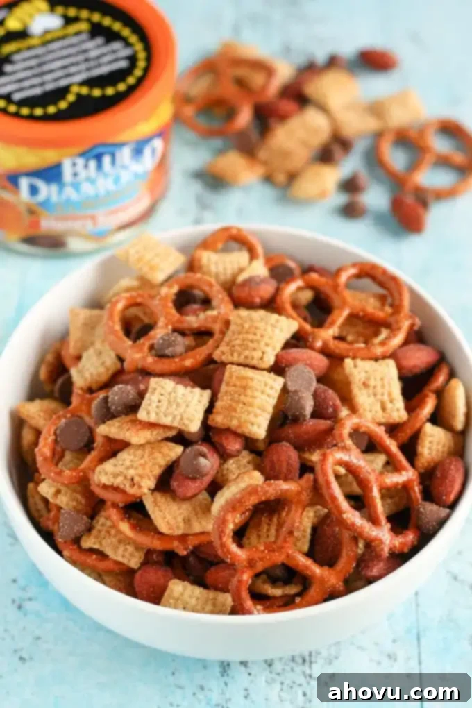 An easy to make snack mix filled with honey, pretzels, chocolate, almonds, and more! This Honey Almond Snack Mix makes a perfect snack for any party or occasion!
