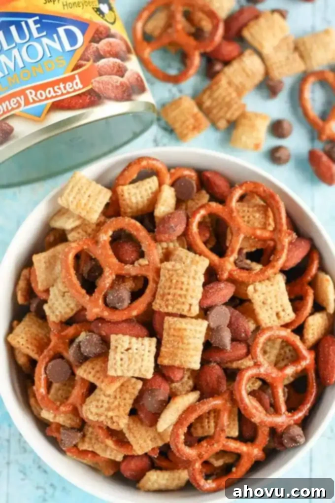 An easy to make snack mix filled with honey, pretzels, chocolate, almonds, and more! This Honey Almond Snack Mix makes a perfect snack for any party or occasion!