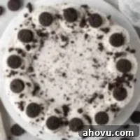 Decadent No-Bake Oreo Cheesecake 11 An overhead view of a no-bake Oreo cheesecake topped with whipped cream and mini Oreos, ready to serve.