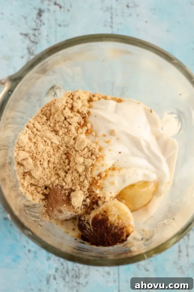Peanut Butter Mocha Smoothie being poured into a glass