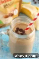 Peanut Butter Mocha Smoothie in a glass with a straw