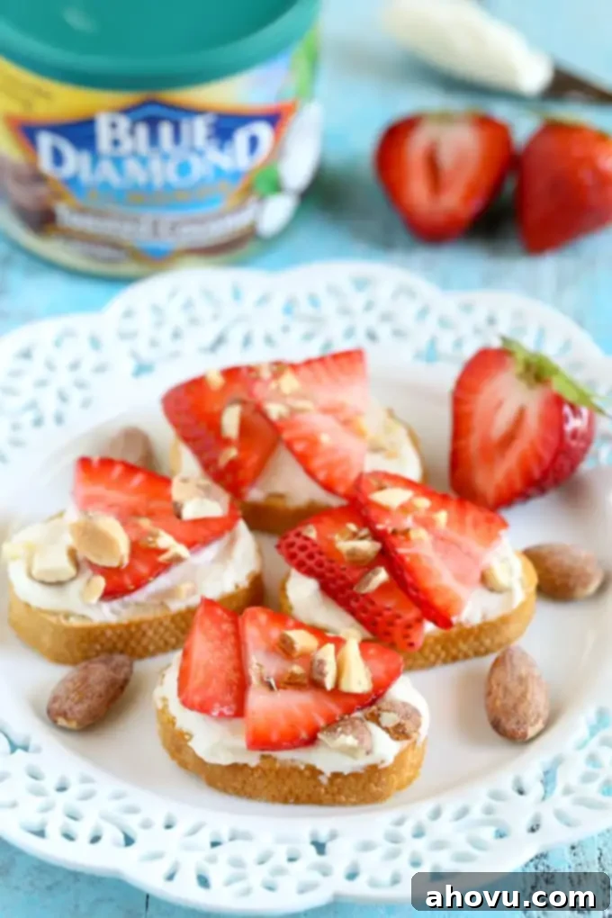 Easy and elegant Strawberry, Almond, and Honey Goat Cheese Crostini for any occasion.