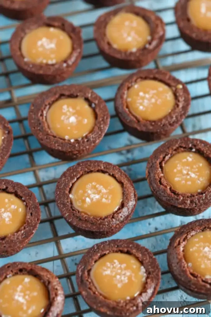 Salted caramel brownie bites on a cooling rack. 