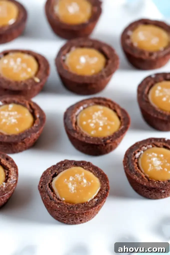 Caramel brownie bites on a white surface. 