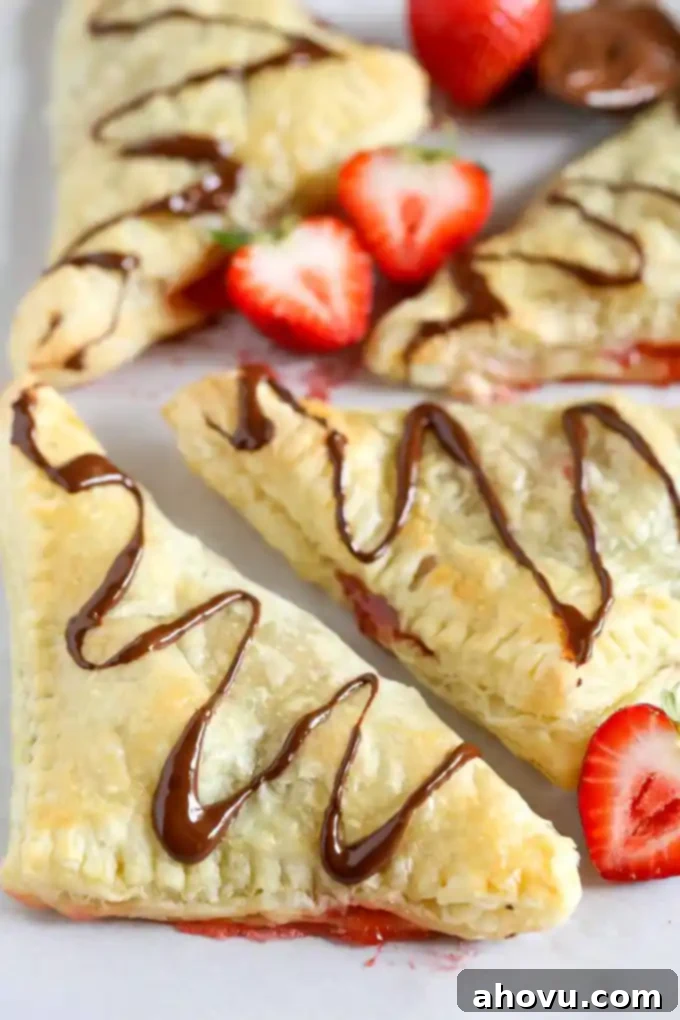 Puff pastry stuffed with chocolate, Nutella, and fresh strawberries. These Chocolate Strawberry Nutella Turnovers make one delicious and decadent dessert!
