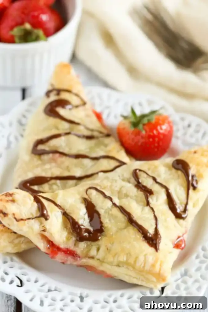 Puff pastry stuffed with chocolate, Nutella, and fresh strawberries. These Chocolate Strawberry Nutella Turnovers make one delicious and decadent dessert!