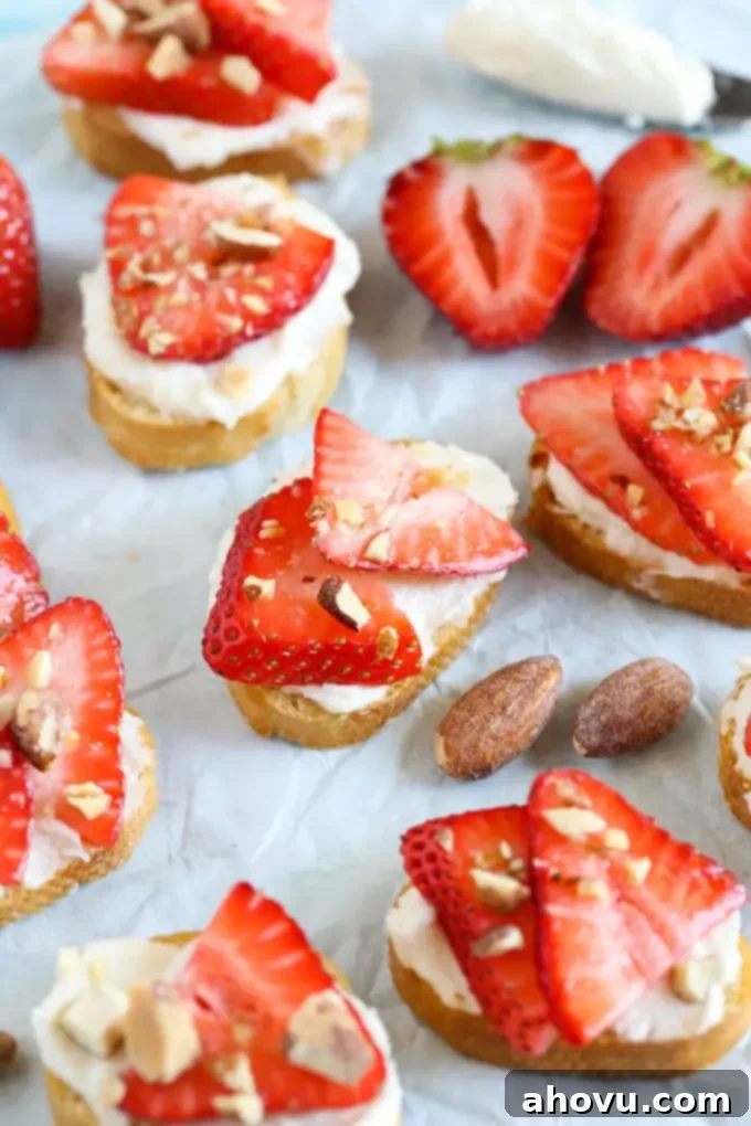 These Strawberry, Almond, and Whipped Honey Goat Cheese Crostini are easy to make and perfect for summer entertaining!