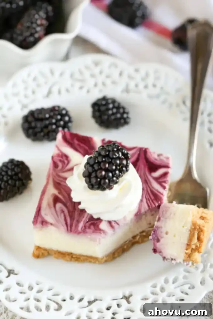 A bowl of creamy cheesecake filling with a spoon, ready to be poured over the graham cracker crust.