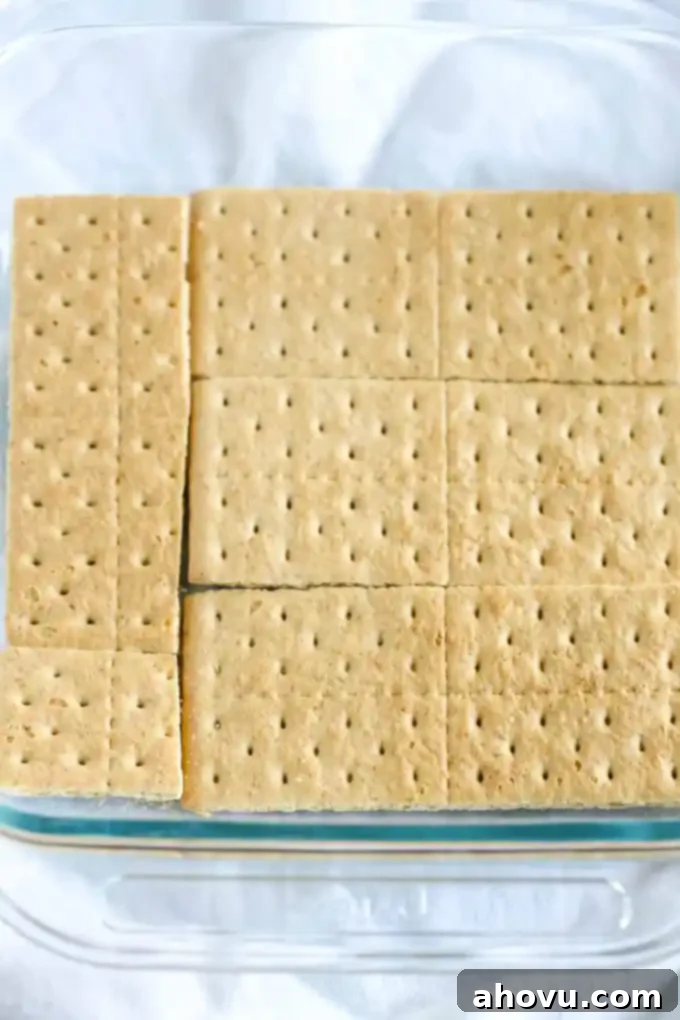 Layers of graham crackers, no-bake pumpkin spice cheesecake filling, and caramel topped off with homemade whipped cream. This No-Bake Pumpkin Caramel Icebox Cake is an easy and delicious fall dessert!