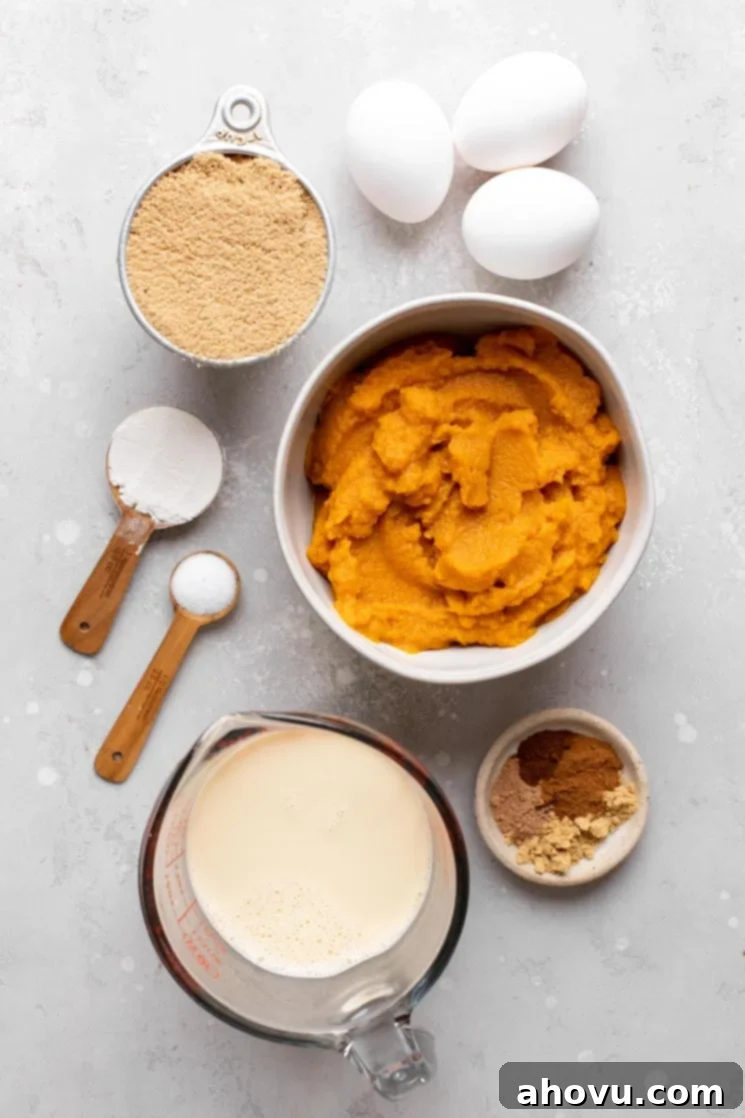 Spiced Pumpkin Perfection 3 An overhead shot showcasing all the essential ingredients laid out for making a delicious pumpkin pie filling, including pumpkin puree, eggs, spices, and evaporated milk.