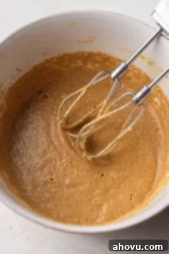 Overhead view of the wet ingredients for the cake batter mixed together.