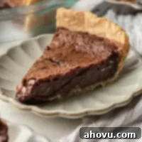 Heirloom Chocolate Pie 9 A slice of chocolate chess pie on a scalloped plate.