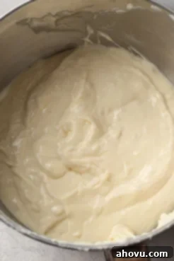 Banana cheesecake filling in a mixing bowl, seen from above.