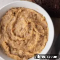 An overhead view of a bowl of German chocolate cake frosting, ready to be used.