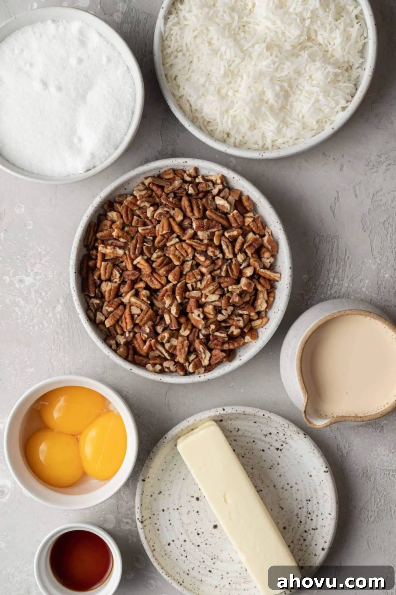An overhead view of the raw ingredients needed for German chocolate cake frosting laid out on a surface.
