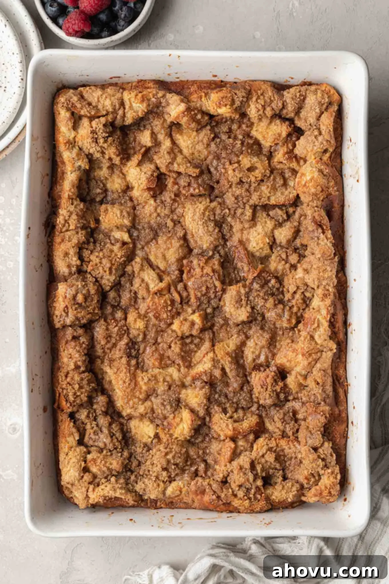 Sweet Morning French Toast Bake 8 An overhead view of a french toast breakfast casserole topped with crumb topping.