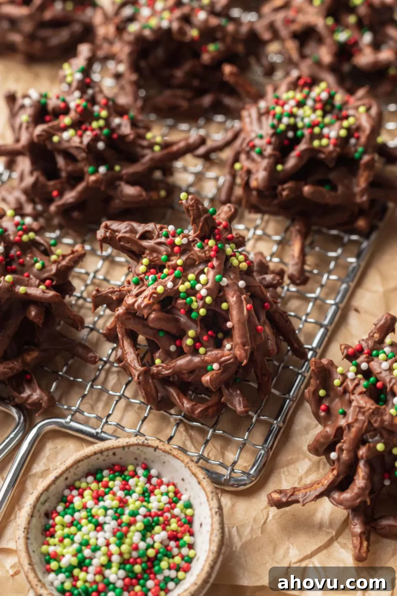 Chocolate haystack cookies on a wire rack, set over parchment paper. 
