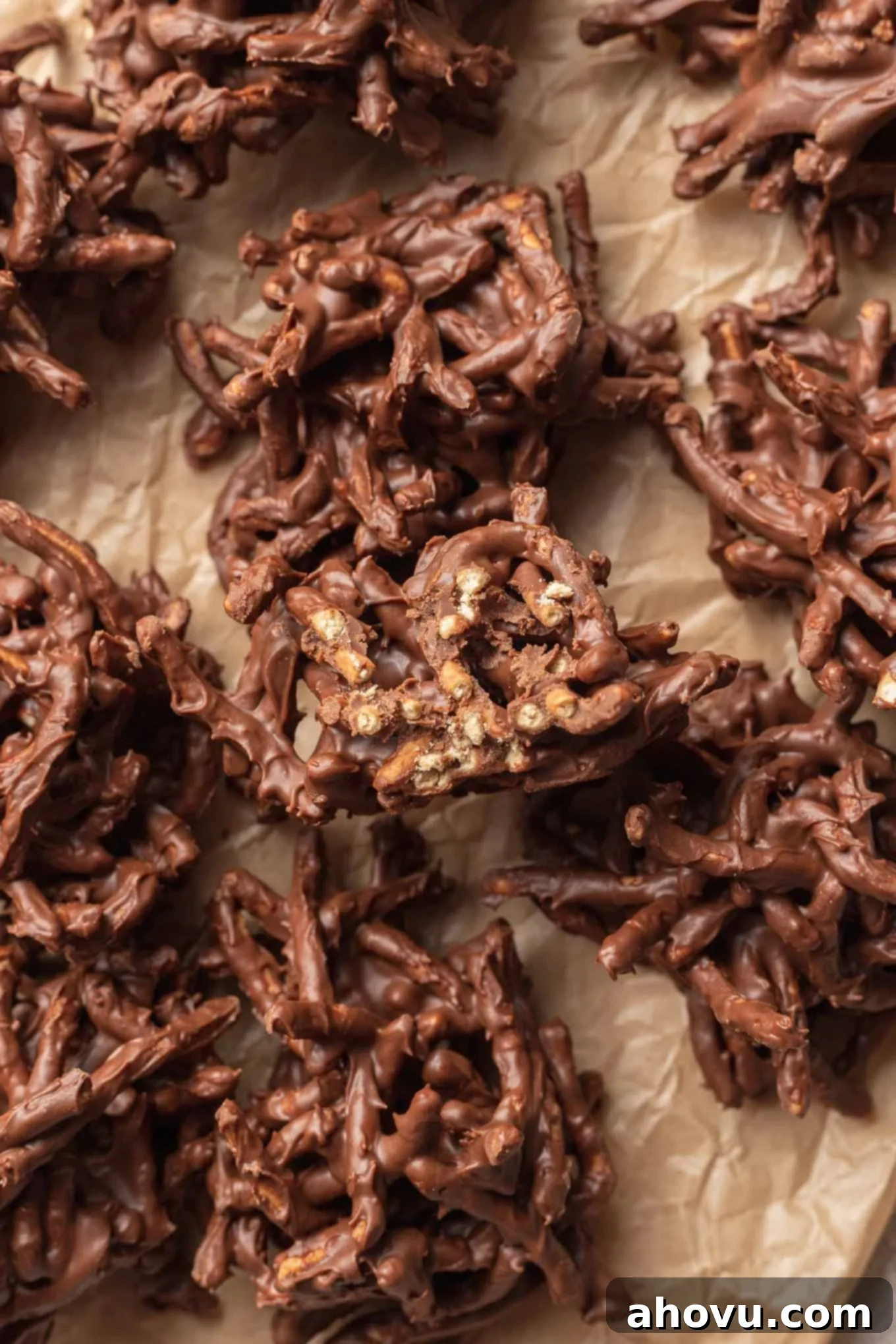 An overhead view of plain haystack cookies on parchment paper. 