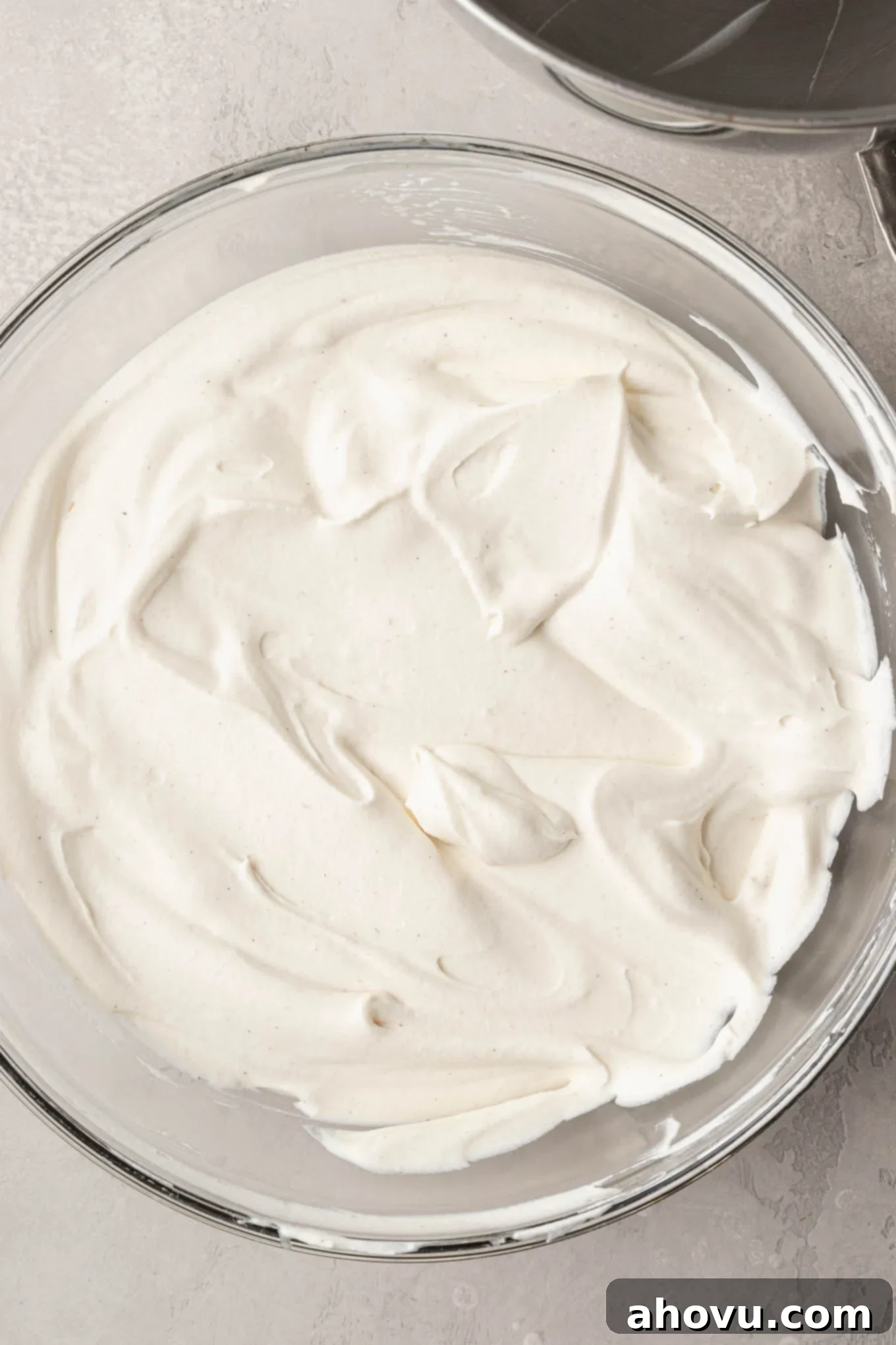 Delicately folded whipped cream blending into the rich, sweetened condensed milk mixture, creating a smooth and uniform base for the ice cream.