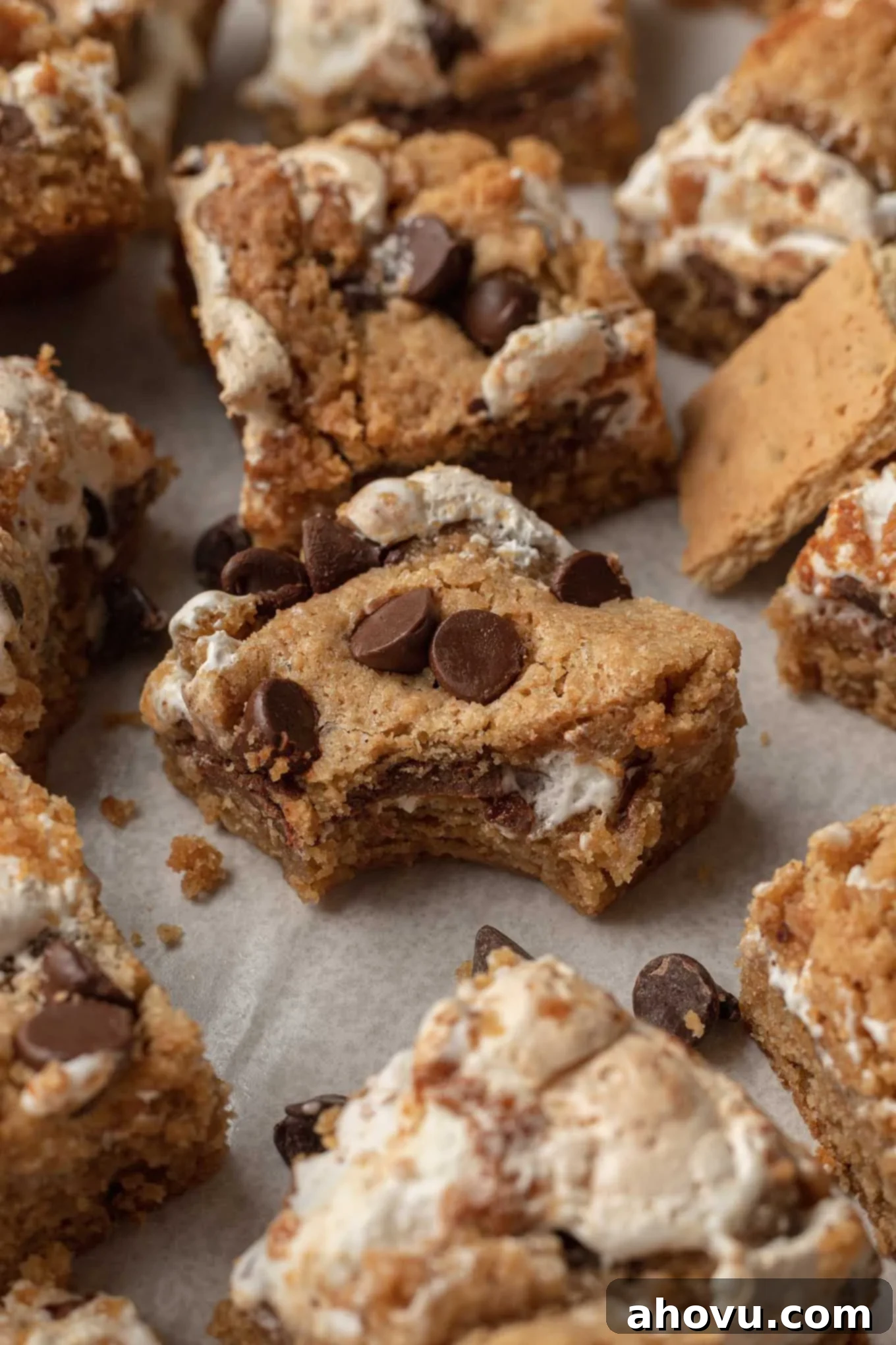 S'mores Bars 2 A s'mores bar with a bite missing surrounded by additional bars.