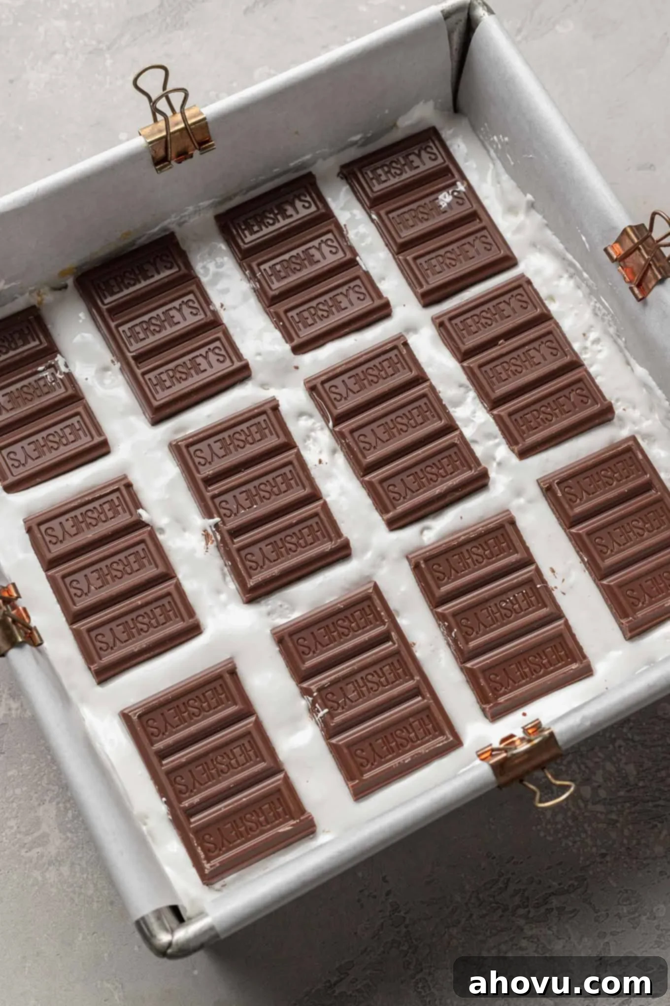 S'mores Bars 6 Marshmallow creme and Hershey's bars layered in a pan on top of graham cracker cookie dough.