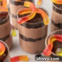 Several dirt cups topped with gummy worms.