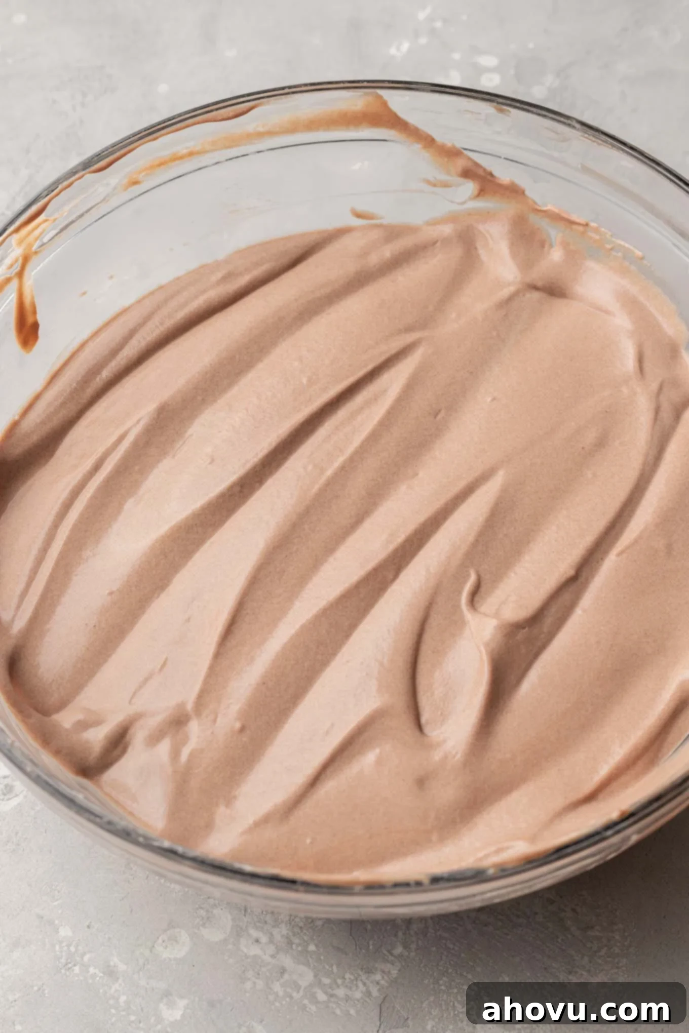 An overhead view of the lightened chocolate pudding mixture with fluffy whipped cream gently folded into it.