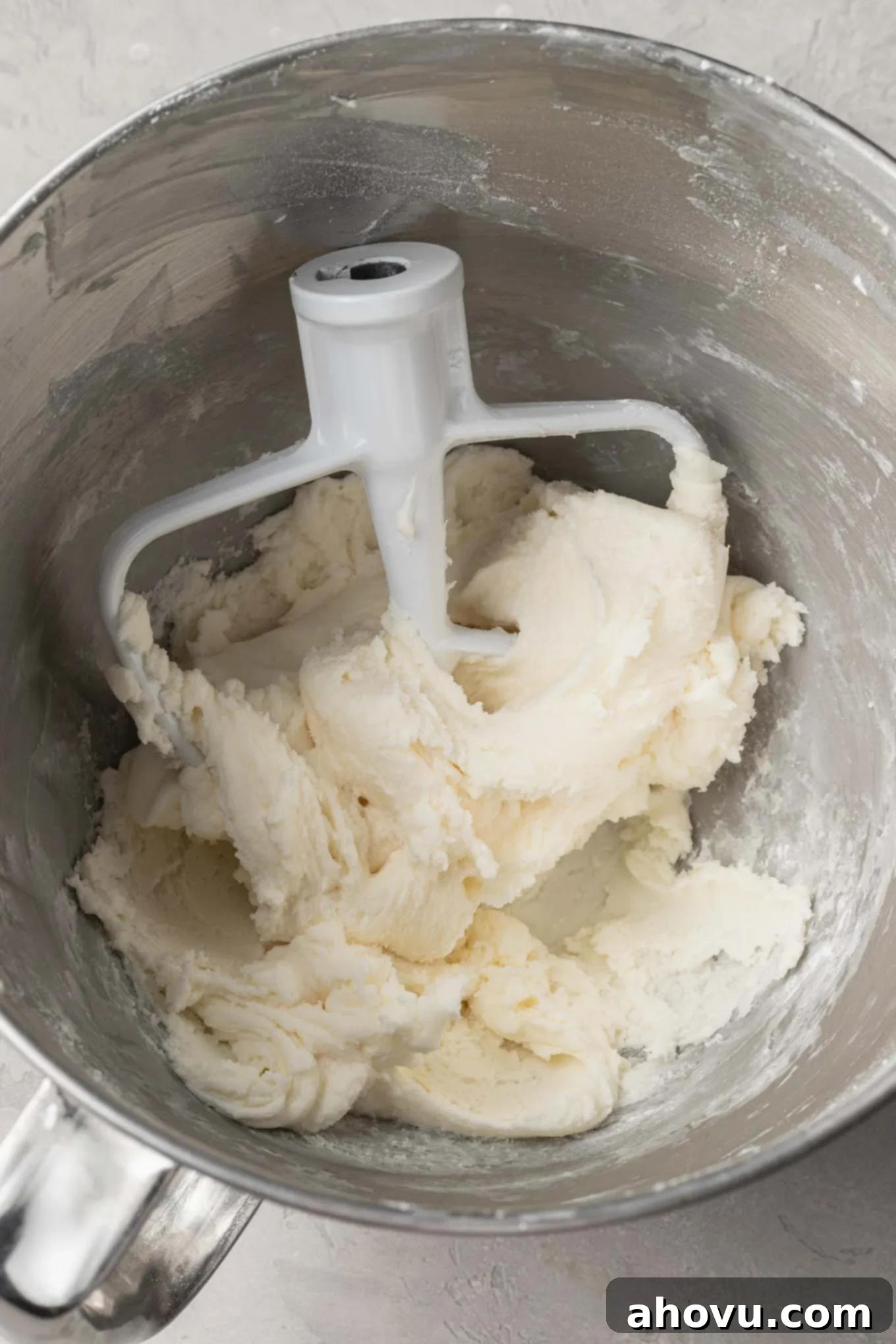 Creamy Dream Mints 6 An overhead view of the fully mixed cream cheese mint mixture in a mixing bowl, showing its smooth, playdough-like consistency before coloring.