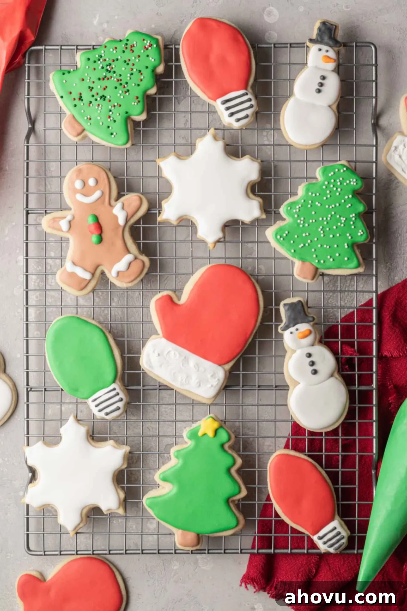 A delightful arrangement of Christmas-themed sugar cookies, beautifully decorated with intricate royal icing designs, displayed from an overhead perspective.