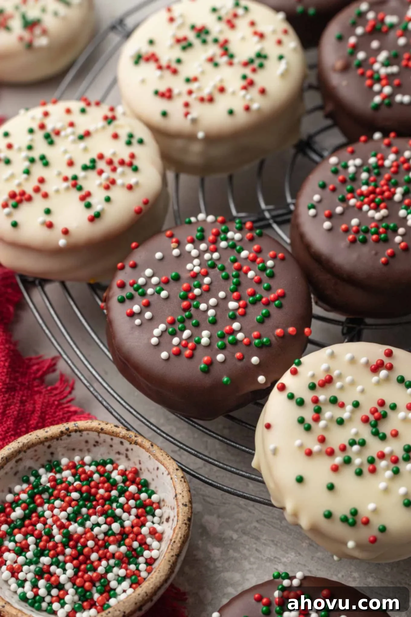 A close-up look at chocolate-covered Ritz cookies on a wire cooling rack. 