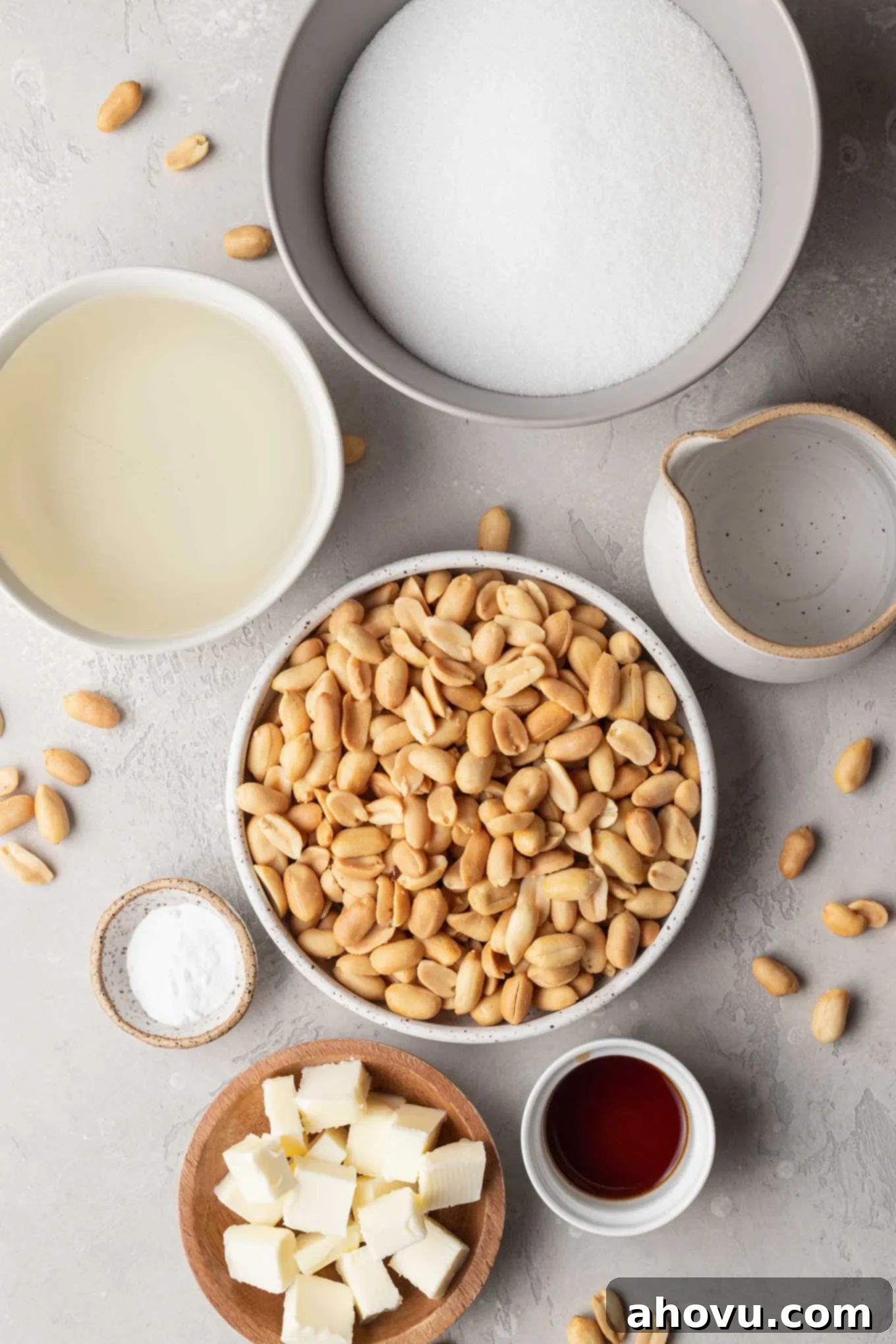 Golden Peanut Brittle 3 An overhead view of the ingredients needed for old-fashioned peanut brittle including peanuts, sugar, corn syrup, butter, and vanilla.