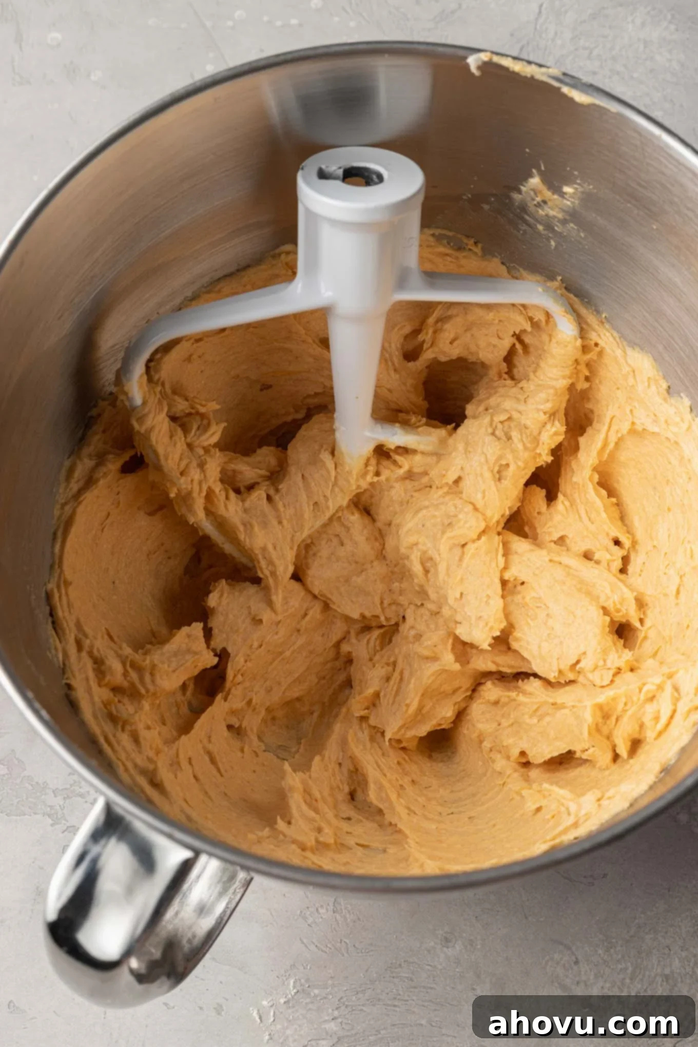 Autumn Pumpkin Sugar Cookies 7 An overhead view of the wet ingredients for pumpkin sugar cookies in a stand mixer.