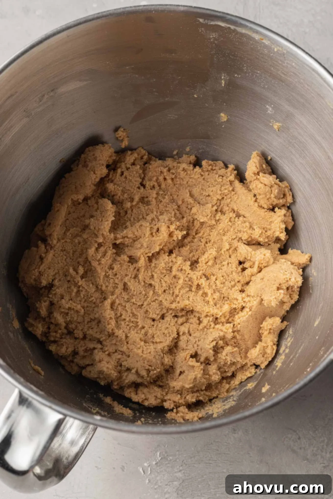 Autumn Pumpkin Sugar Cookies 8 An overhead view of pumpkin sugar cookie dough in the bowl of a stand mixer.