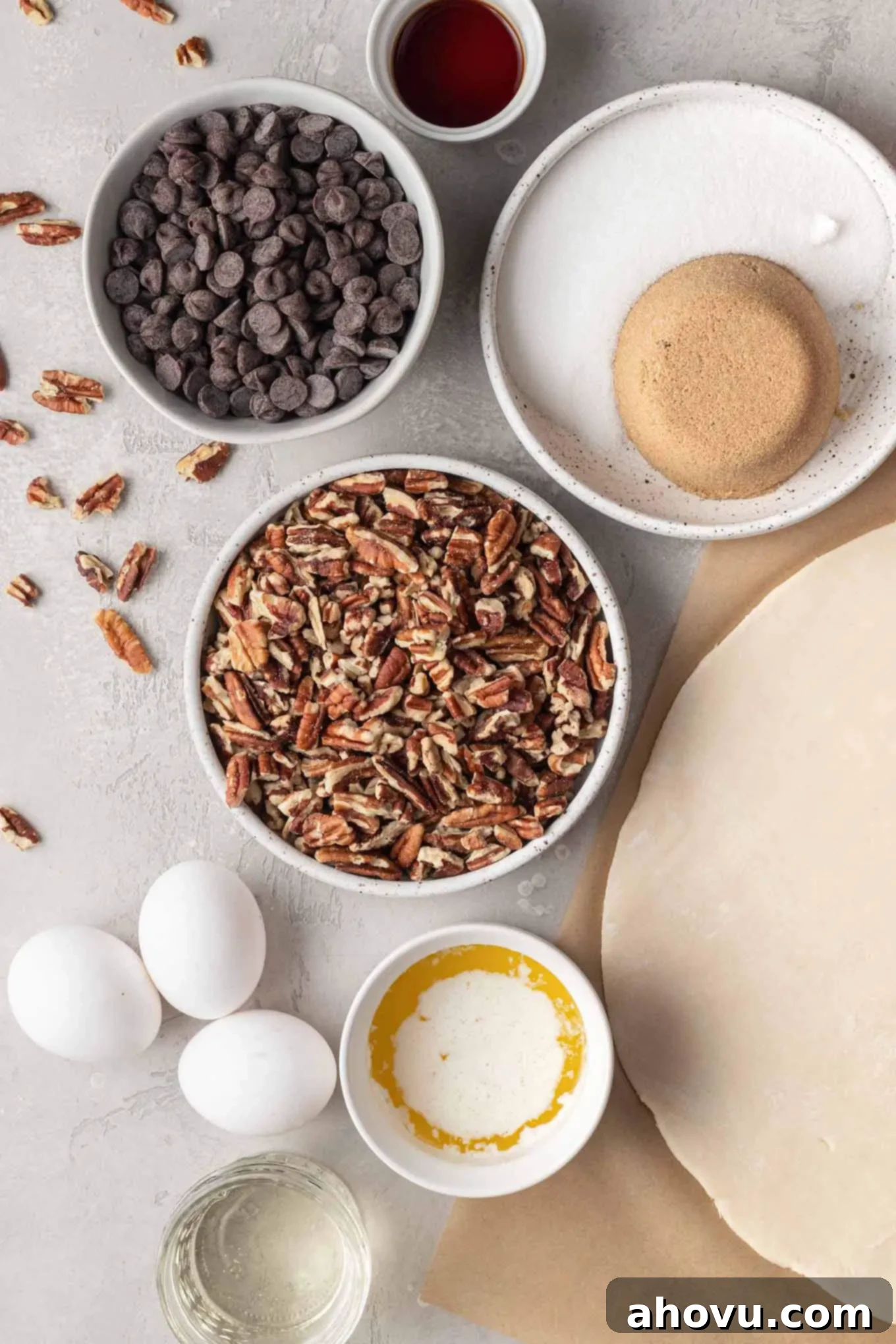 Decadent Chocolate Pecan Dream 3 An overhead view showcasing all the essential ingredients neatly laid out on a clean surface, poised for the preparation of a delicious chocolate chip pecan pie.