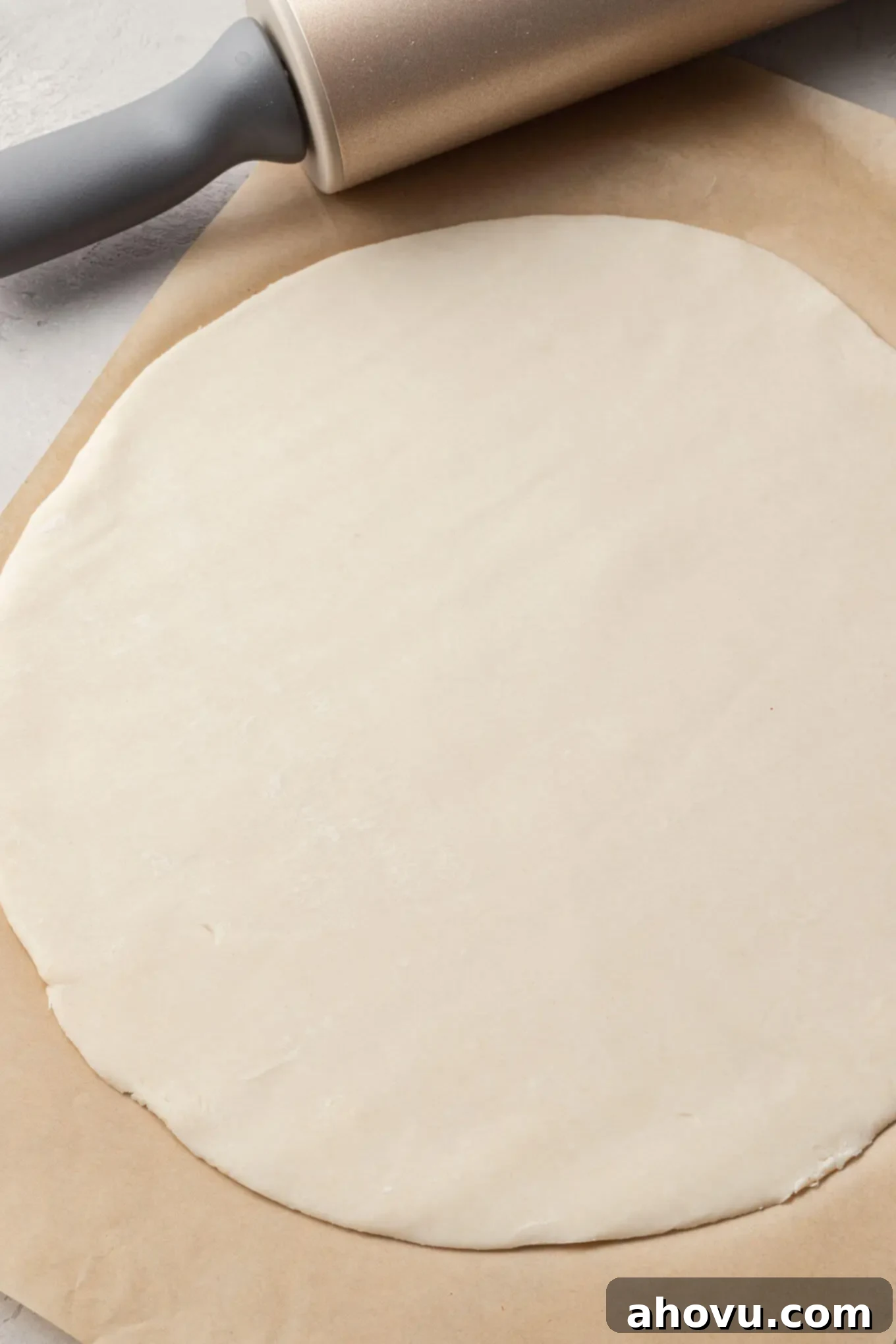 Decadent Chocolate Pecan Dream 4 An overhead view of fresh pie dough meticulously rolled into a perfect circle, ready to be transferred to a pie plate.