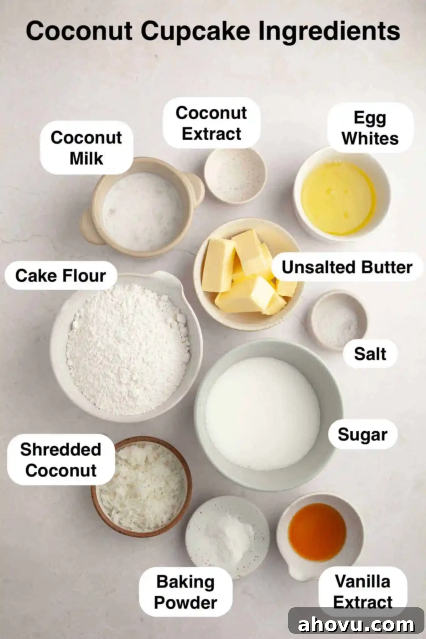 An overhead view of the dry ingredients and wet ingredients laid out on a kitchen counter, ready to make coconut cupcakes.
