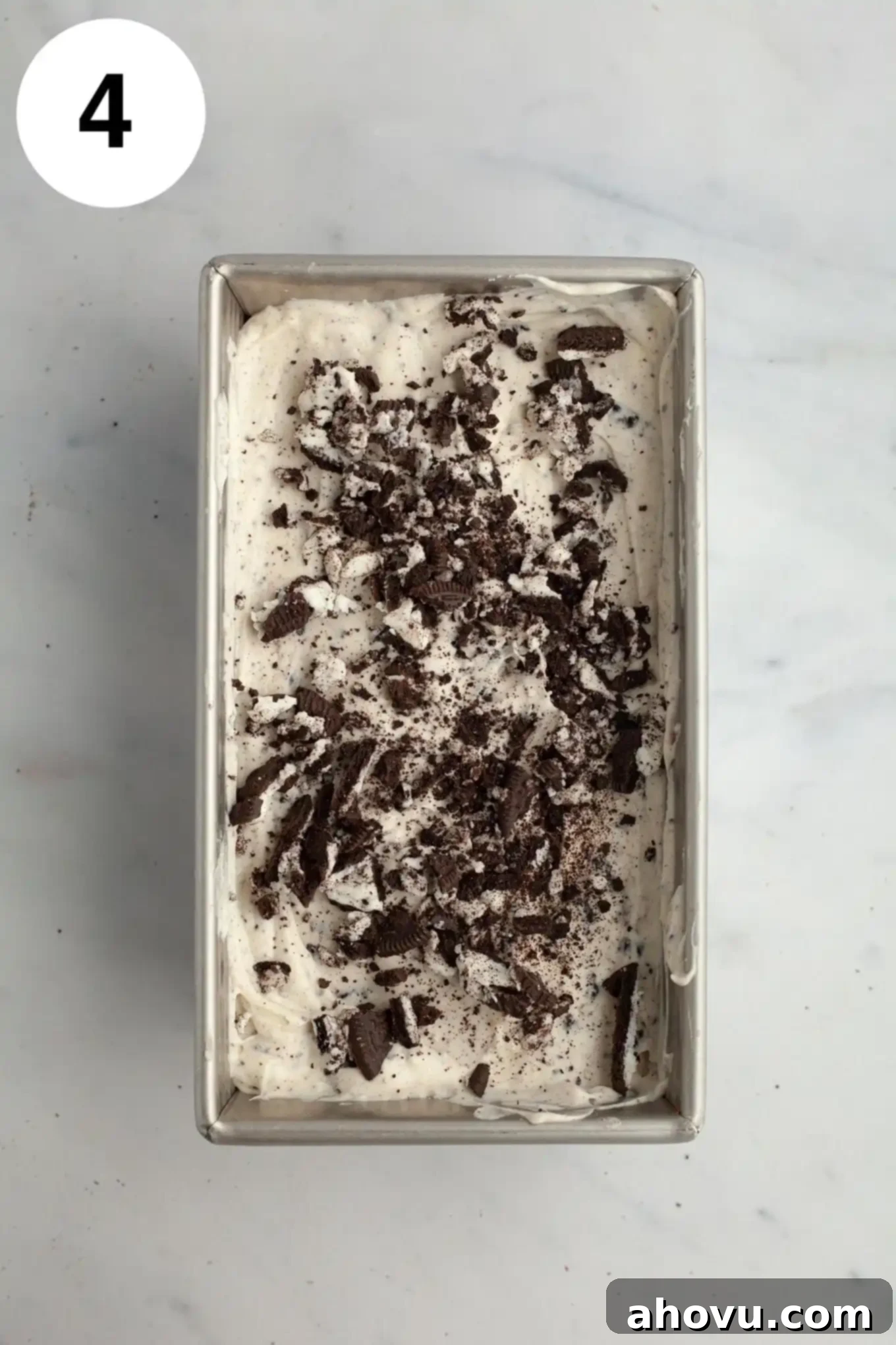 Midnight Cookie Dream 7 An overhead view of Oreo ice cream in a metal loaf pan.