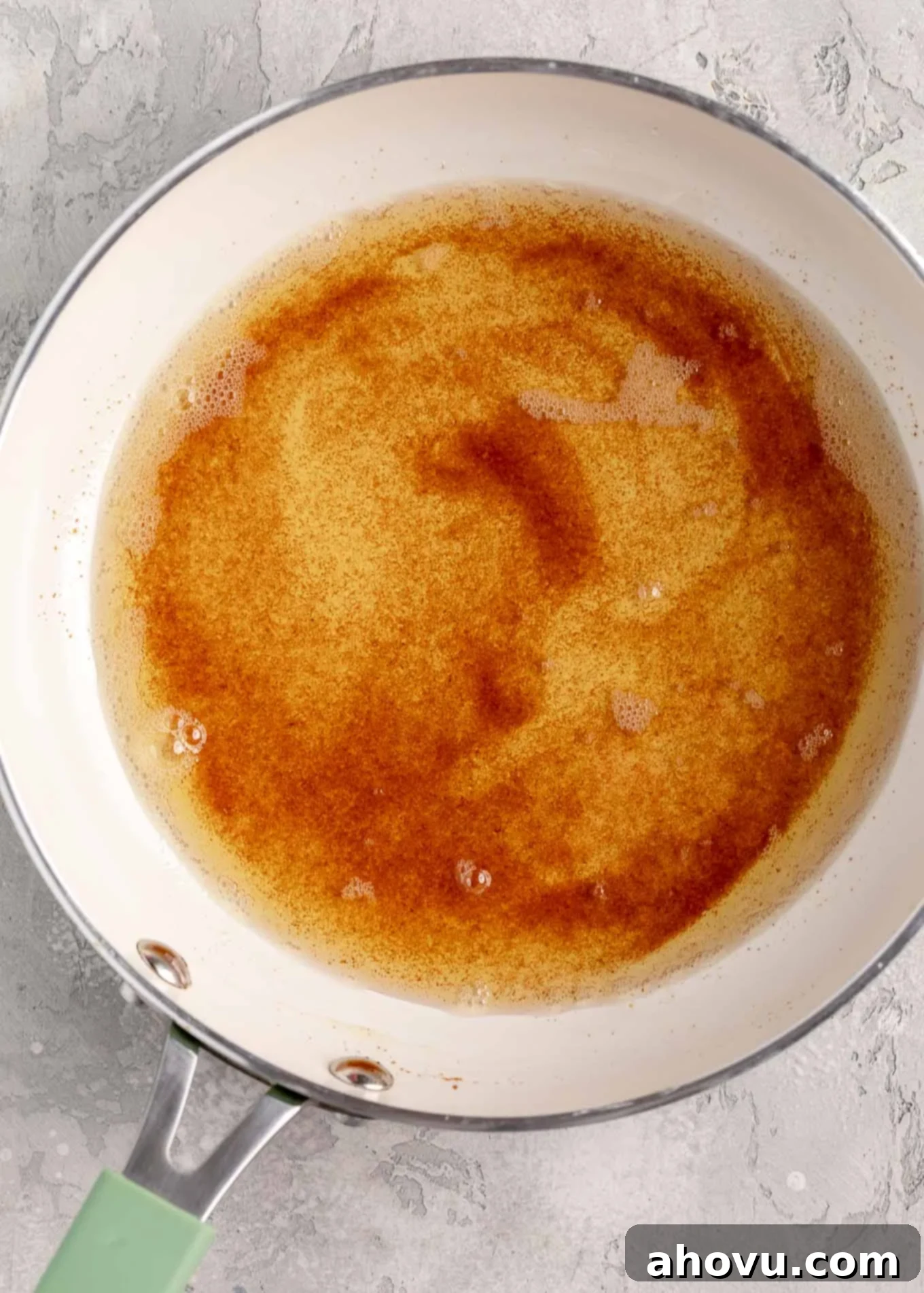 The Art of Brown Butter 2 Perfectly browned butter in a white skillet, showcasing its rich, amber color and toasted milk solids ready to enhance any dish.