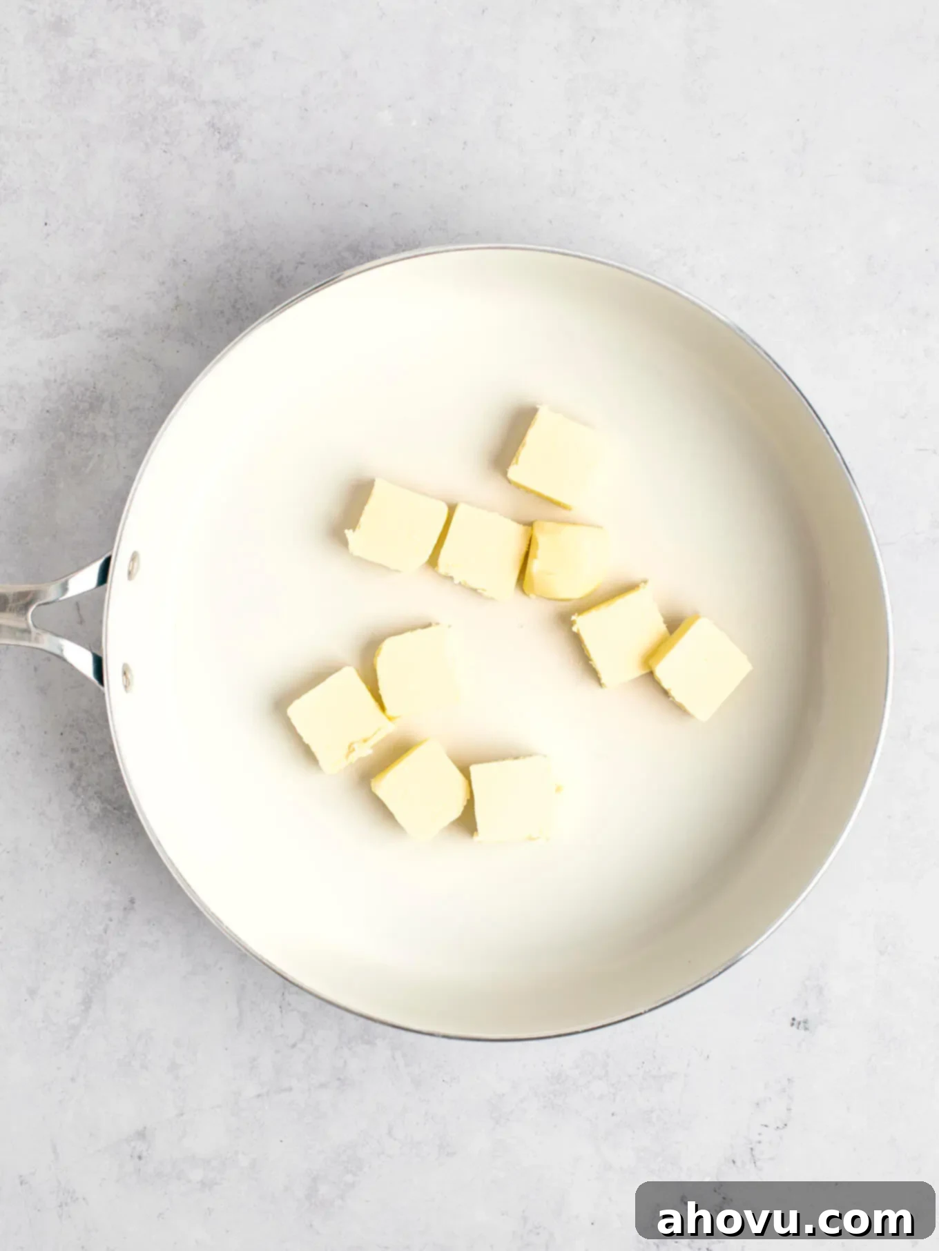 The Art of Brown Butter 4 Evenly sliced butter pieces placed in a light-colored skillet, ready to be melted and browned.