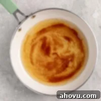 The Art of Brown Butter 10 An overhead view of brown butter in a skillet, showcasing its golden color and the toasted milk solids.